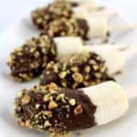 side view of Frozen Banana Pops on white plate