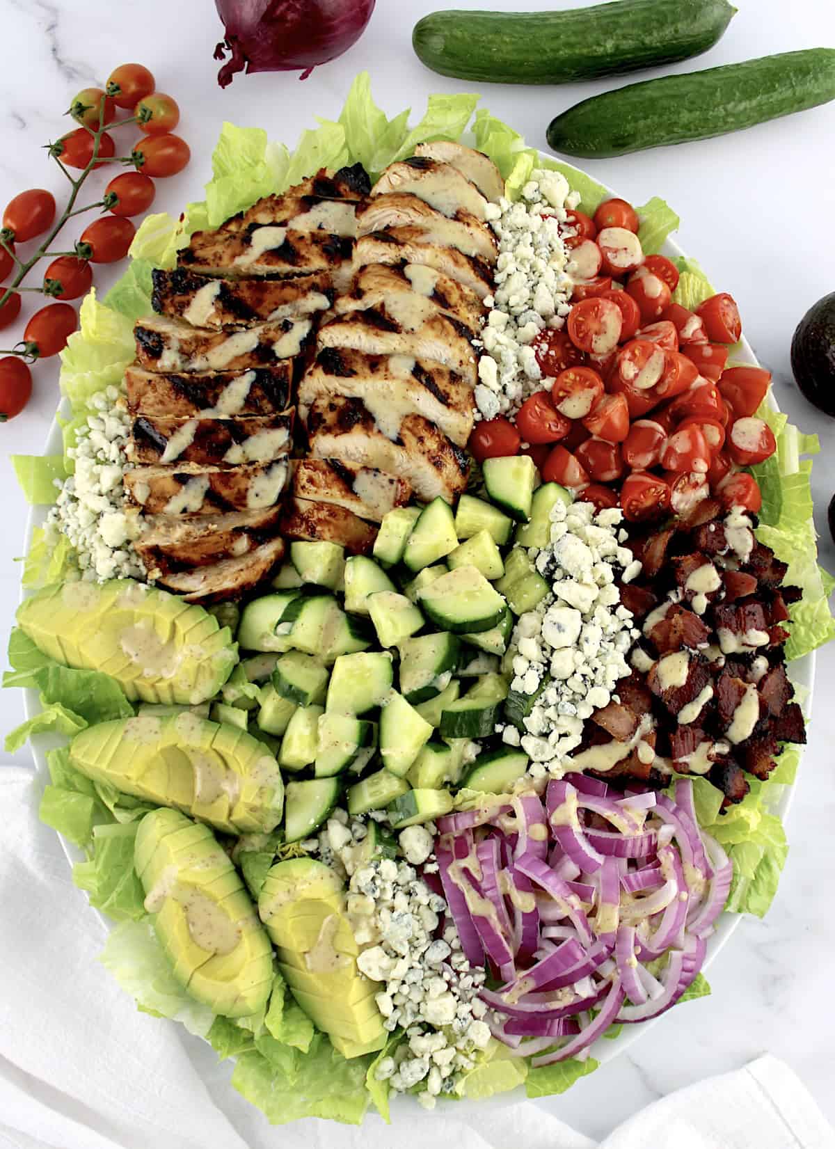 Honey Mustard Chicken Salad on oval platter with fresh veggies in back