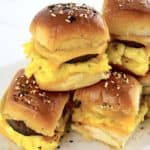 closeup of Sausage Breakfast Sliders stacked on white plate