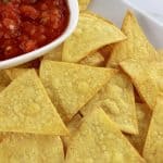 Easy Baked Tortilla Chips on white plate with salsa