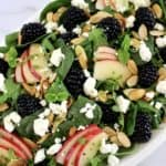 Spinach and Arugula Salad in white oval platter