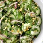 Cucumber Salad with red onion, fresh chopped herbs and toasted pine nuts