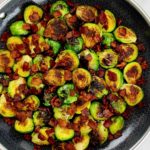 Sautéed Brussels Sprouts with Bacon in skillet