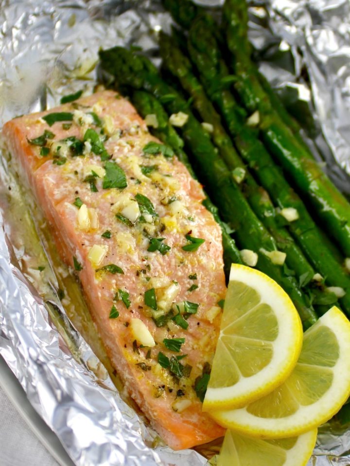 closeup of Salmon Asparagus Foil Packet with slices of lemon