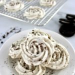 Sugar-Free Cookies and Cream Meringues in white bowl with cookies and more meringues in back on cooling rack